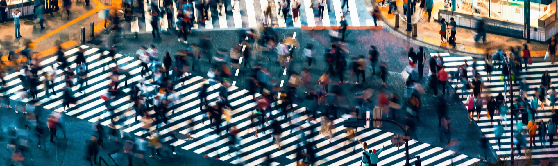 Pedestrians crossing a busy junction